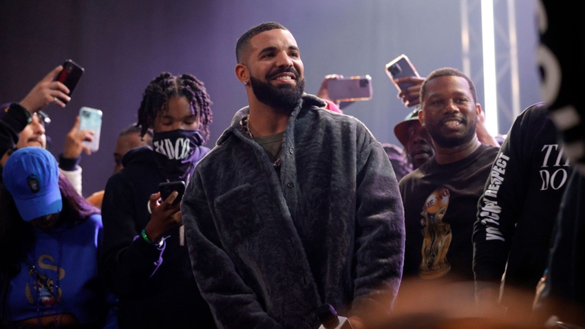 Drake, center, speaks onstage during his Till Death Do Us Part rap battle