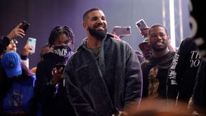 Drake, center, speaks onstage during his Till Death Do Us Part rap battle