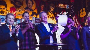 Tennessee Gov. Bill Lee signs into law the ELVIS Act at a music venue in Nashville, Tennessee