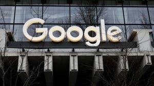White Google logo outside a grey building