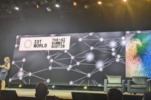 Presenter on stage at AI summit
