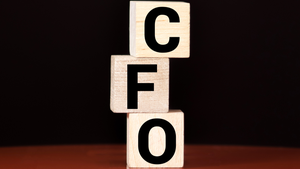 Image of a chair with a CFO name plate