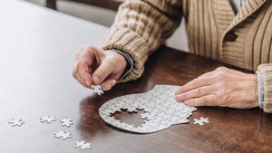 Senior person doing a jigsaw