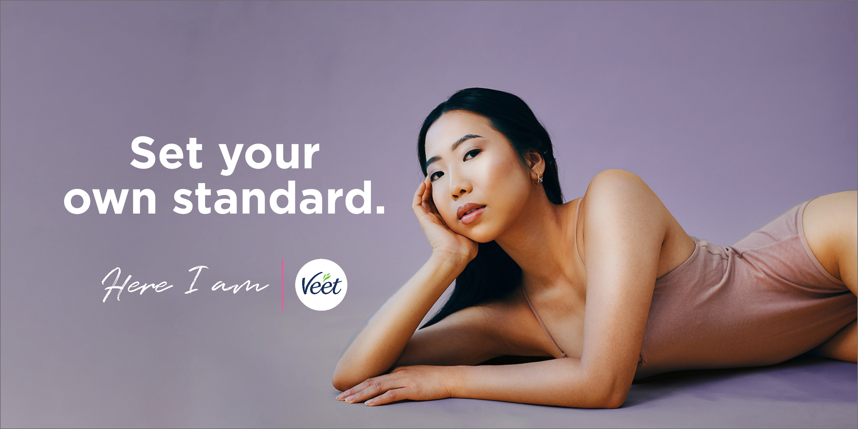 Girl laying with one hand on cheeks in a bathing suit with copy "Set your own standard." on top and Here I am with Veet logo