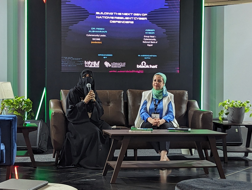 Dr. Reem Alshammari and Abeer Khedr on a sofa at Black Hat Middle East and Africa's campus stage