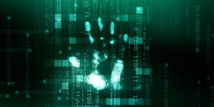 A handprint over binary code