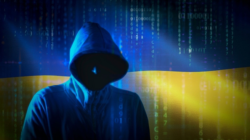 A hooded figure in front of the Ukraine flag