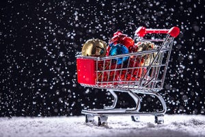 Shopping cart with presents in the snow