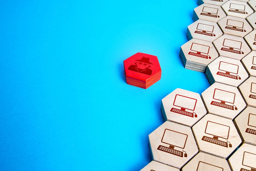 Illustration, using hexagonal wooden tiles, of a spy hexagon trying to infiltrate the corporate network.