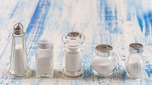 Salt shakers with a blue and while background Salt shakers with a blue and while background