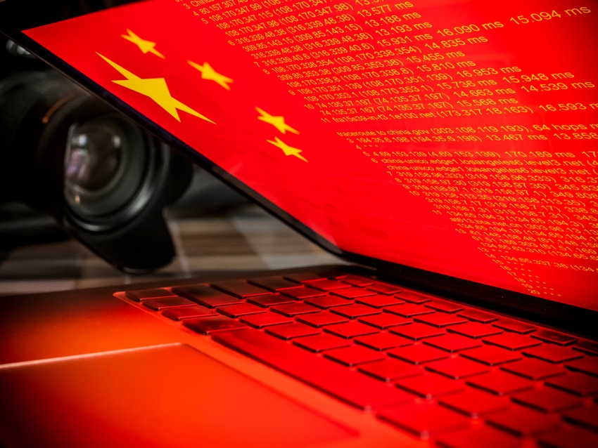 A laptop with the Chinese flag as the desktop wallpaper