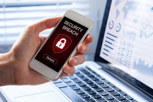 Image shows a hand holding a mobile phone with the words "Security Breach" and the image of a lock on the screen
