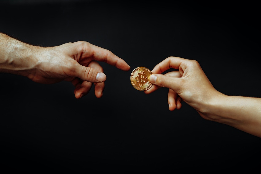 passing a bitcoin from one hand to another