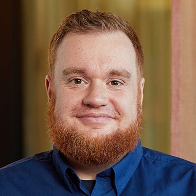 Benjamin Adolphi, Head of Security Research at Promon, has red hair and beard