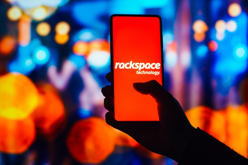 Rackspace logo on a phone screen with blurred colorful lights in the background 