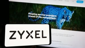 Person holding smartphone with logo of company Zyxel Communications Corporation on screen in front of website Person holding smartphone with logo of company Zyxel Communications Corporation on screen in front of website