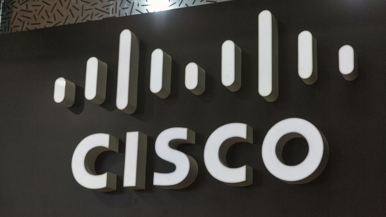 Cisco logo on a black wall Cisco logo on a black wall