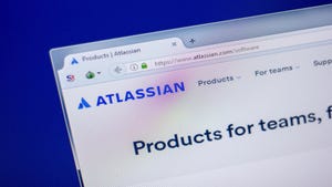 The Atlassian website open on a laptop screen