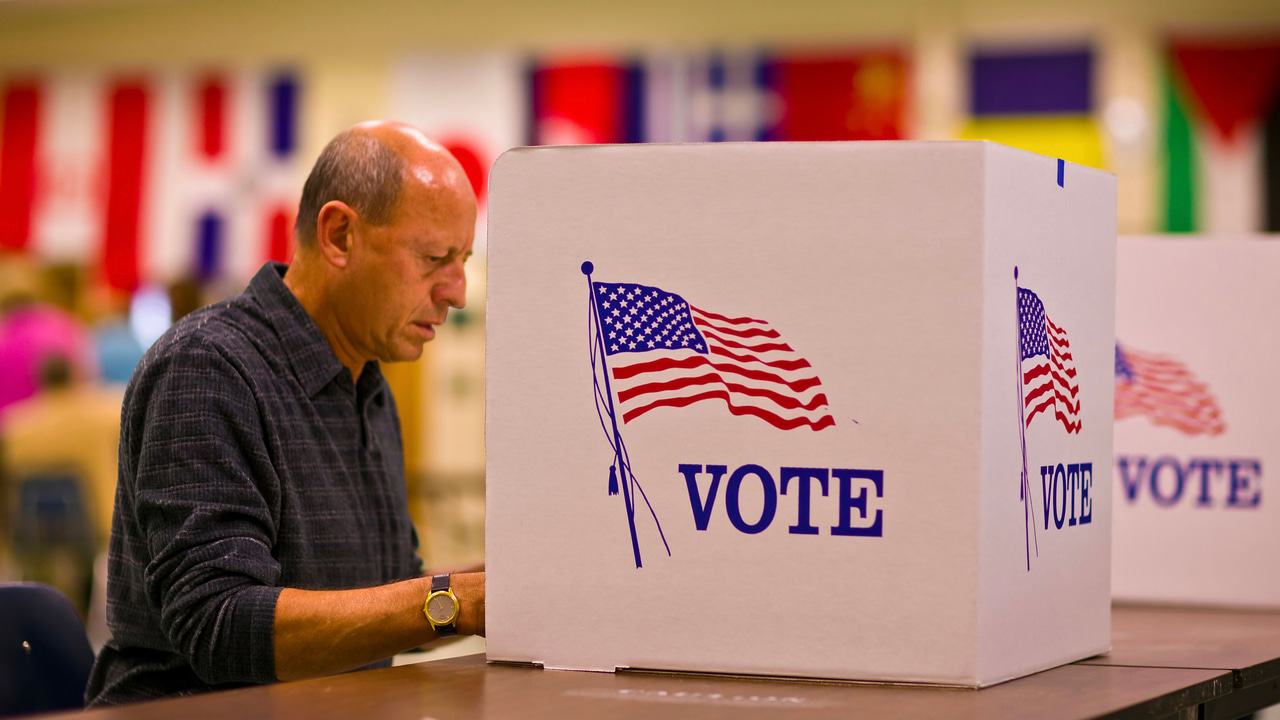 A voter at a voting poll A voter at a voting poll