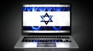 A laptop with the Israeli flag on the screen