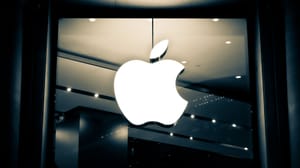 Apple's logo hanging in a store Apple's logo hanging in a store