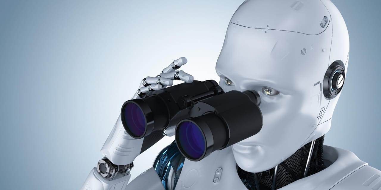 双眼鏡を持ったロボットが何かを探してノートパソコンを見ている。 双眼鏡を持ったロボットが何かを探してノートパソコンを見ている。