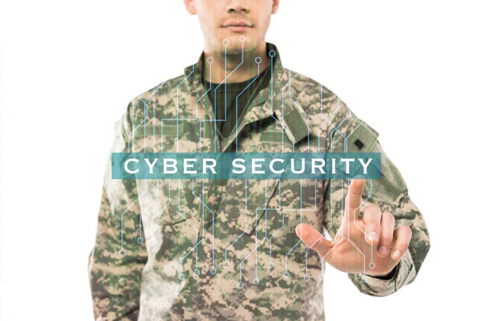 Image of man in military uniform with his fingers touching the word cybersecurity