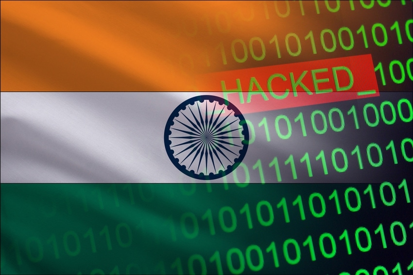 Binary code and the word hacked against a backdrop of the Indian flag