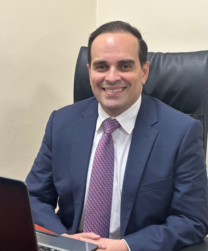 Tawfiq Talhouni in an office chair Tawfiq Talhouni in an office chair