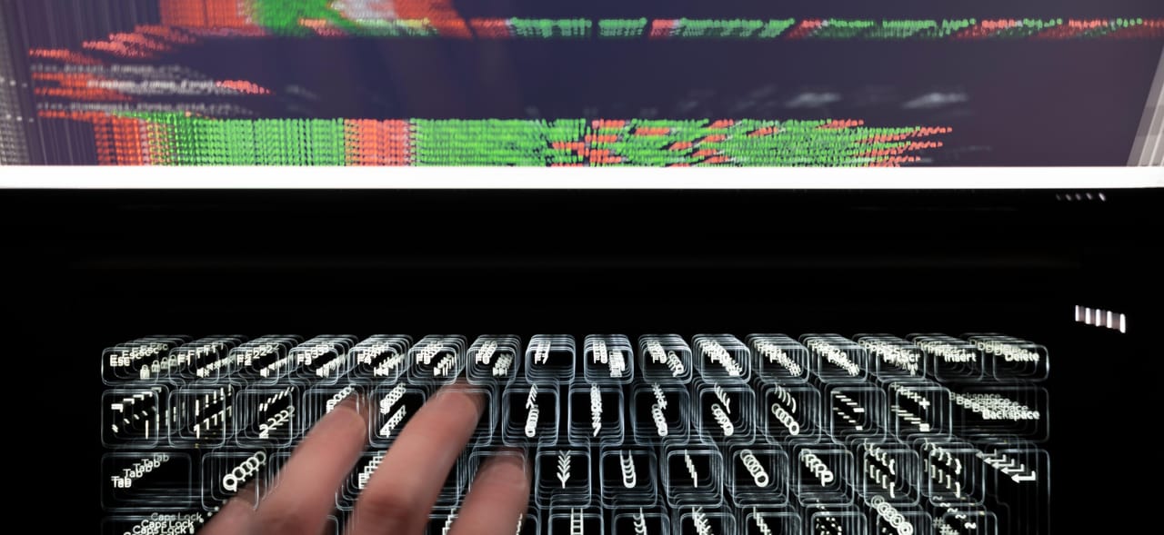 Person typing on a laptop keyboard; the image looks slightly out of focus, like the camera is zooming in Person typing on a laptop keyboard; the image looks slightly out of focus, like the camera is zooming in