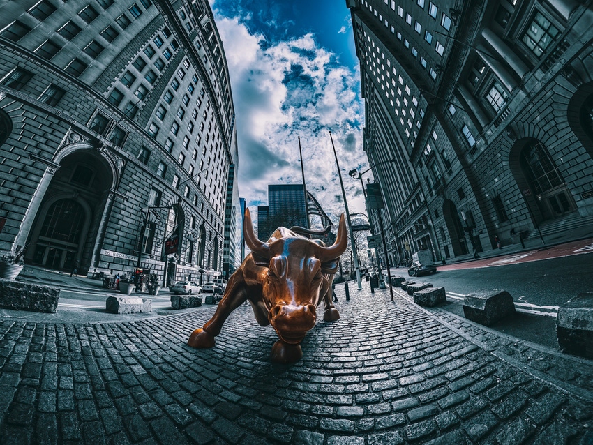 bronze sculpture of charging bull in wall street, new york
