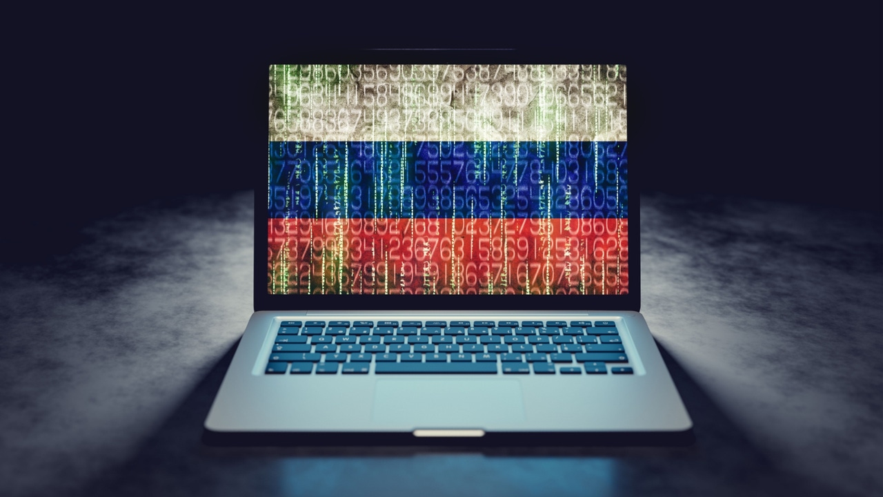 The Russian flag covered by code on a laptop screen The Russian flag covered by code on a laptop screen