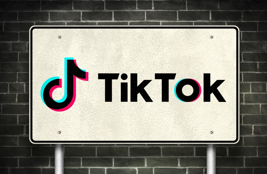 The TikTok logo on a street sign