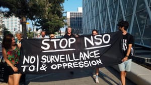 A photo of activists in Israel protesting NSO Group in front of the company's office building. A photo of activists in Israel protesting NSO Group in front of the company's office building.