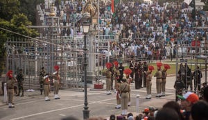 Soldiers from India and Pakistan saluting