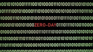 Red ZERO-DAY text amid yellow binary code Red ZERO-DAY text amid yellow binary code