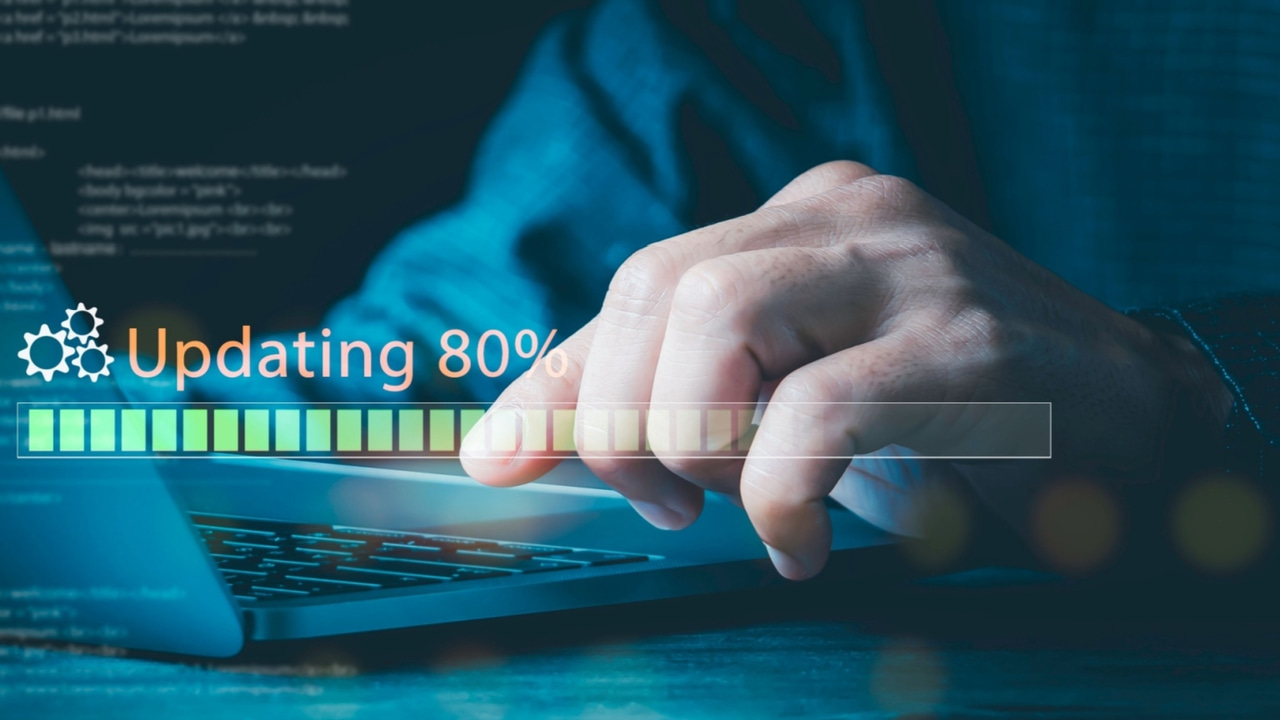 Hand of a person sitting at a computer about to hit a key on the keyboard with the text Hand of a person sitting at a computer about to hit a key on the keyboard with the text