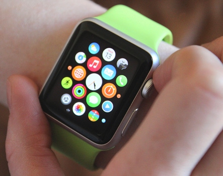 an image of a person adjusting their Apple Watch on their wrist.