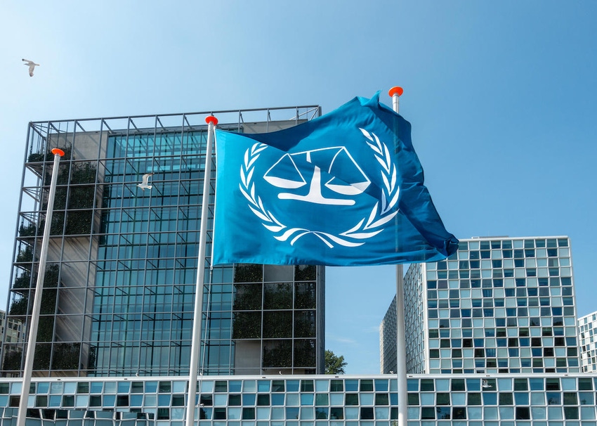 The flag of the ICC flying in front of The Hague International Criminal Court buildings in The Netherlands