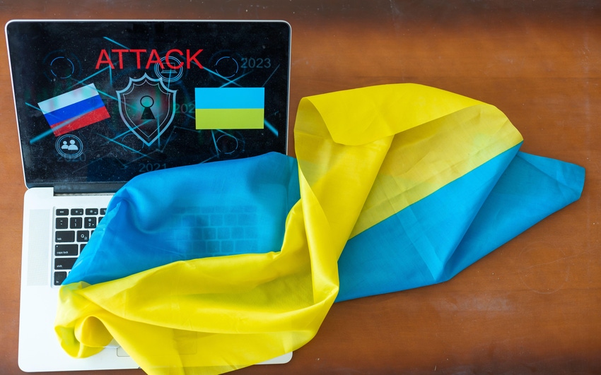 Ukraine flag and laptop depicting cyberattack