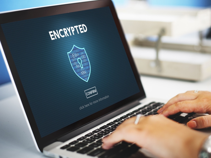 The word "encryption" on a laptop screen