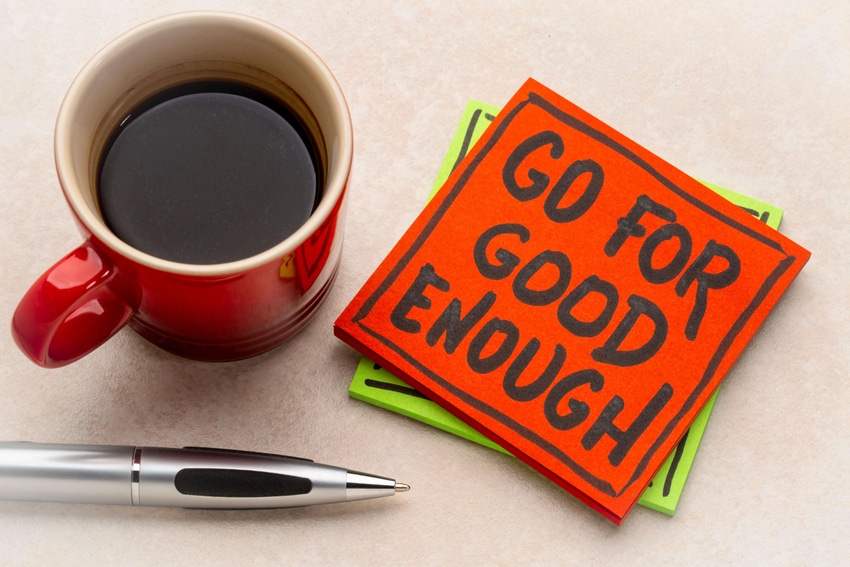 go for good enough reminder note with a cup of coffee and a silver pen