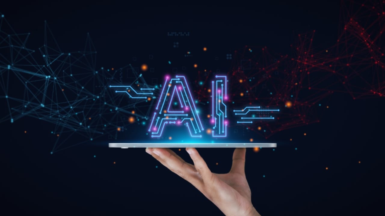 白い肌の人間の手が薄型タブレット端末の上に「提供」するAIの文字 白い肌の人間の手が薄型タブレット端末の上に「提供」するAIの文字