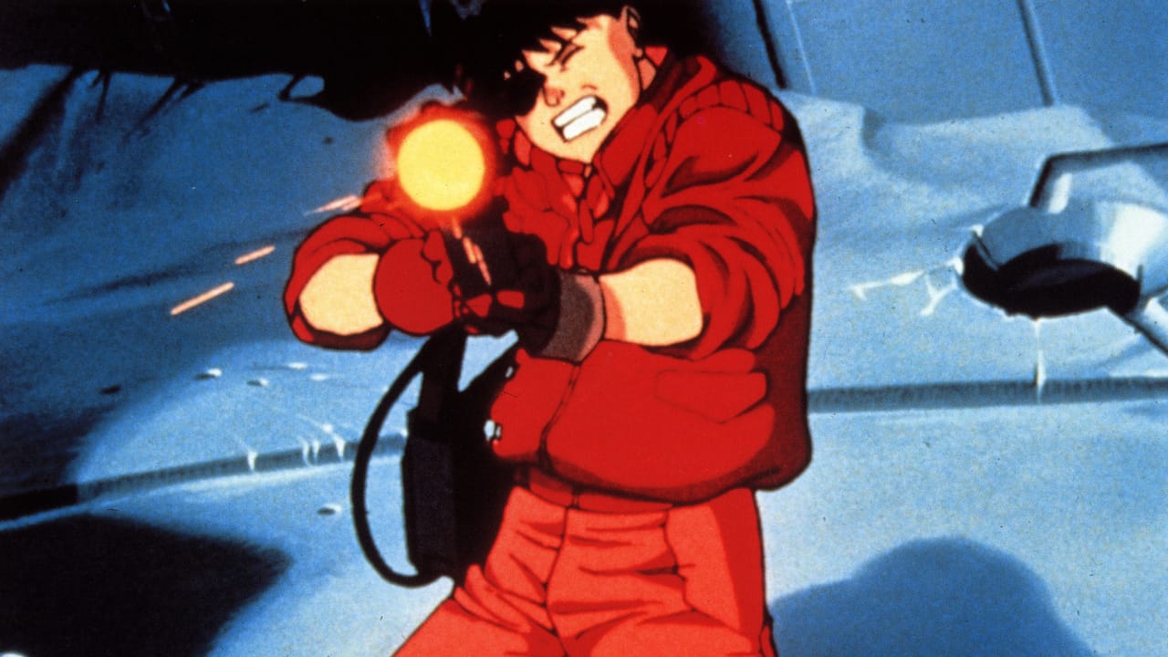 1988年のアニメ映画『AKIRA』の静止画で、赤い服を着てレーザーガンを指差す人物 1988年のアニメ映画『AKIRA』の静止画で、赤い服を着てレーザーガンを指差す人物