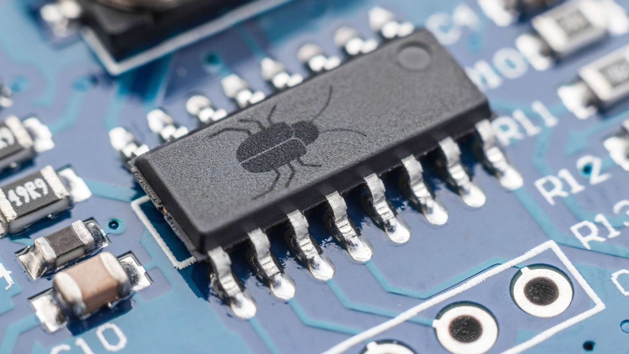 A circuit chip with an image of a bug on it A circuit chip with an image of a bug on it