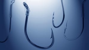 Four fish hooks in water Four fish hooks in water