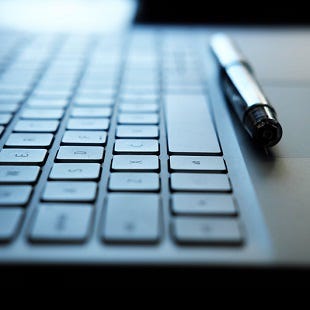 Laptop keyboard and pen. Source: Dorota Szymczyk via Alamy Stock Photo