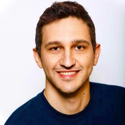 Asaf Fried, Data Scientist at Cato Networks, has short brown hair and wears a navy crew-neck shirt
