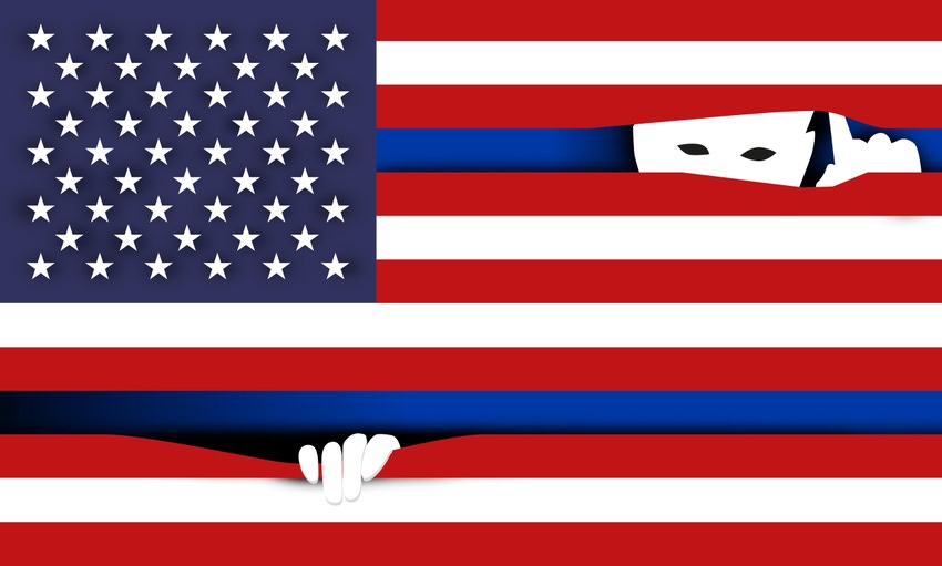 Eyes peering through an American flag