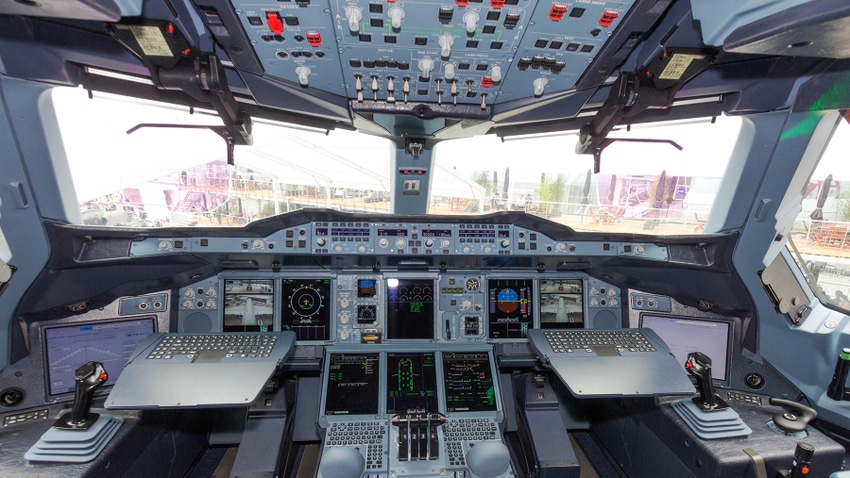 Airbus A380 cockpit, full of dials and controls and computers and joysticks